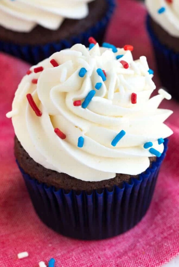 Simple chocolate cupcakes with vanilla buttercream are a favorite classic cupcake recipe! Impress your guests with this simple chocolate cake and sweet buttercream frosting.