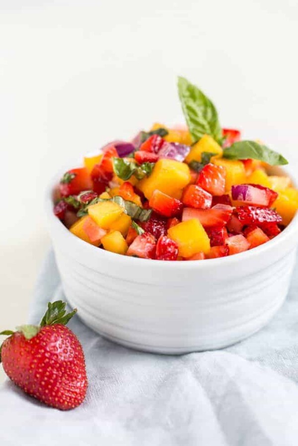 Chopped mango salsa in a white bowl.