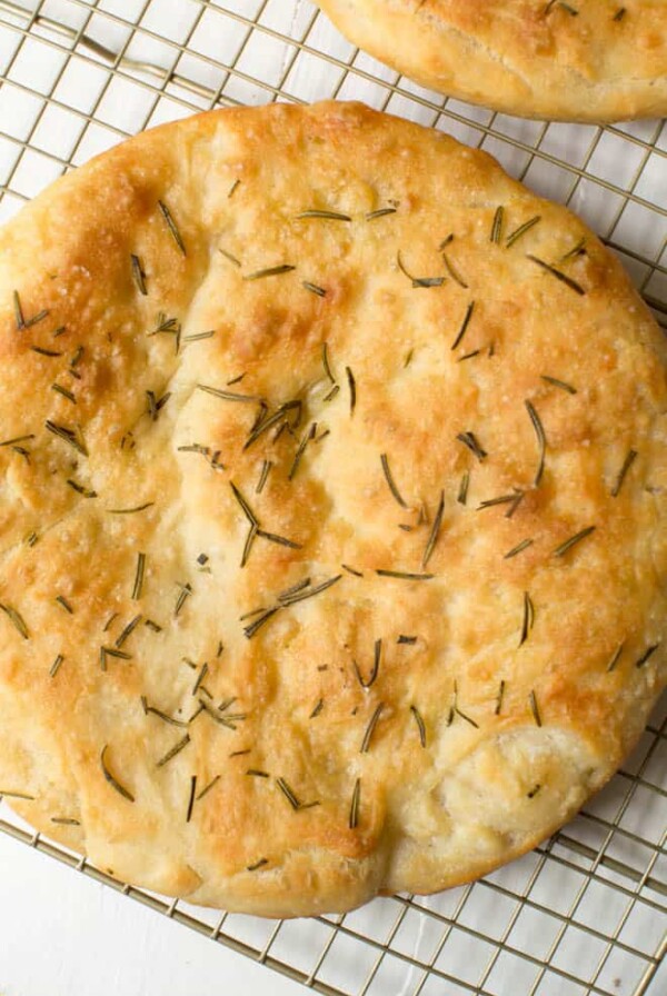 loaf of rosemary focaccia on a cooling rack