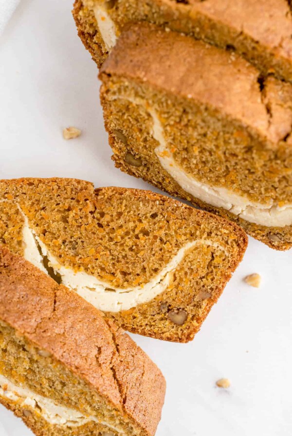 slices of carrot loaf cut on a white counter