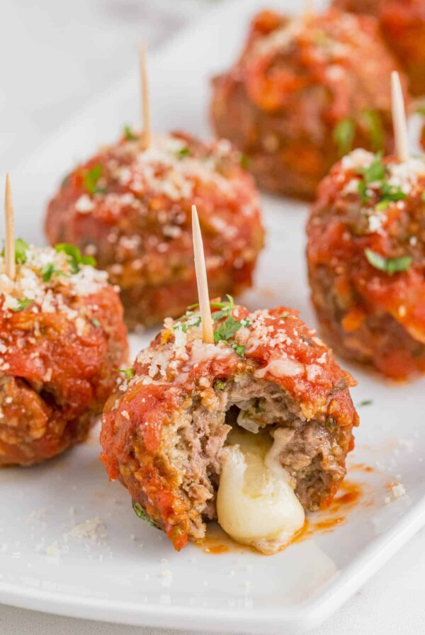 cheese oozing out of a meatball