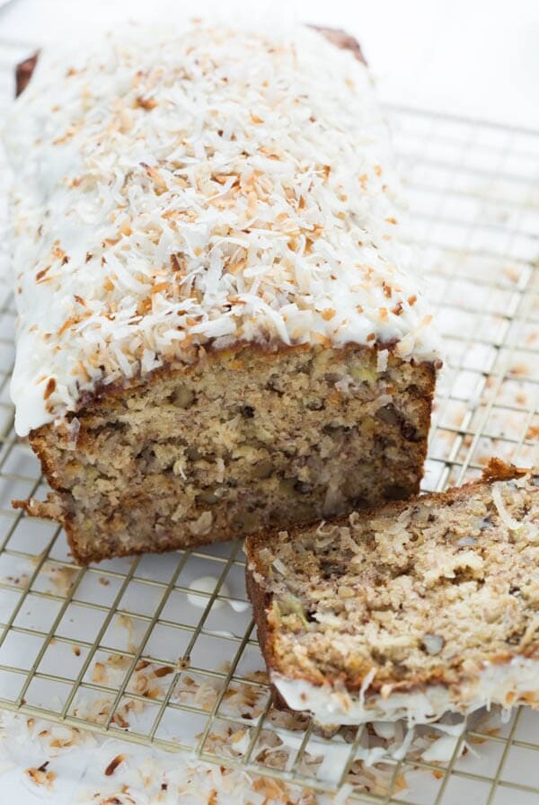 Banana Coconut Crunch Bread with Coconut Cream Icing - a simple quick bread that will add flavor to any morning!