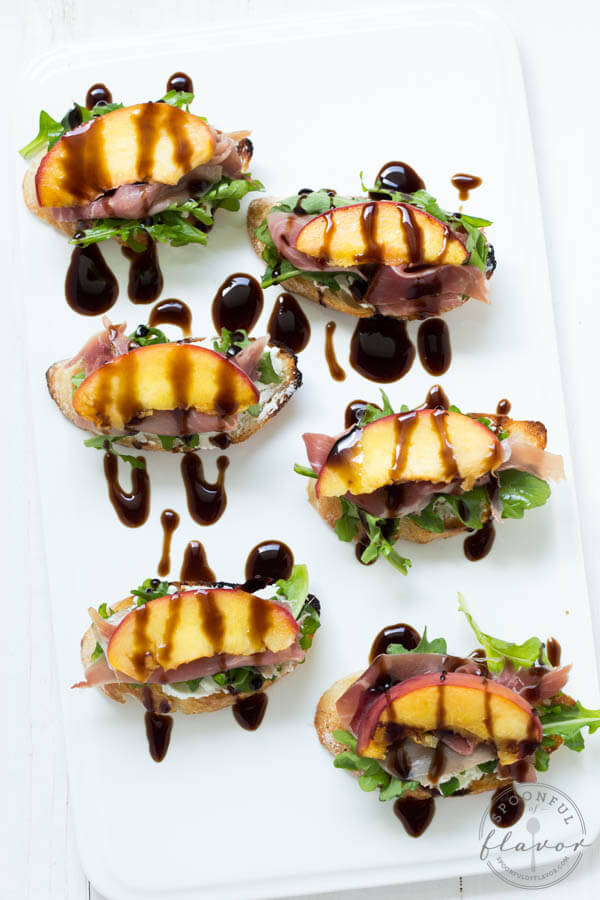 Grilled Peach Crostini with Arugula, Prosciutto and Goat Cheese is the perfect light summer snack, appetizer or lunch!