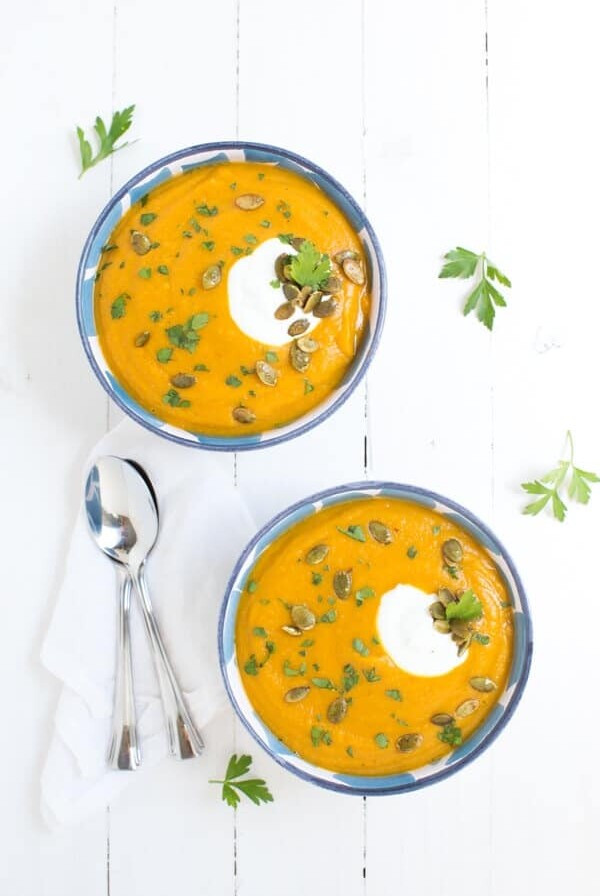 Roasted Butternut Squash and Red Lentil Soup is made with fresh, healthy ingredients and is garnished with Greek yogurt, pepitas and parsley!