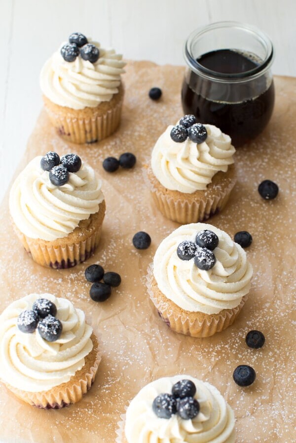 Blueberry French Toast Cupcakes are irresistible! A cinnamon maple cake is topped with maple buttercream frosting and fresh blueberries.