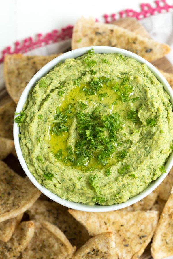 Lemon Spinach Hummus includes everything you love about hummus with the addition of spinach to create this snack packed with green goodness. Serve with homemade baked seasoned pita chips!