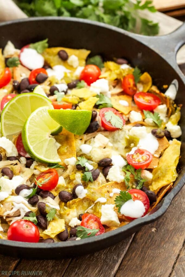 a skillet filled with easy chicken chilaquiles and toppings