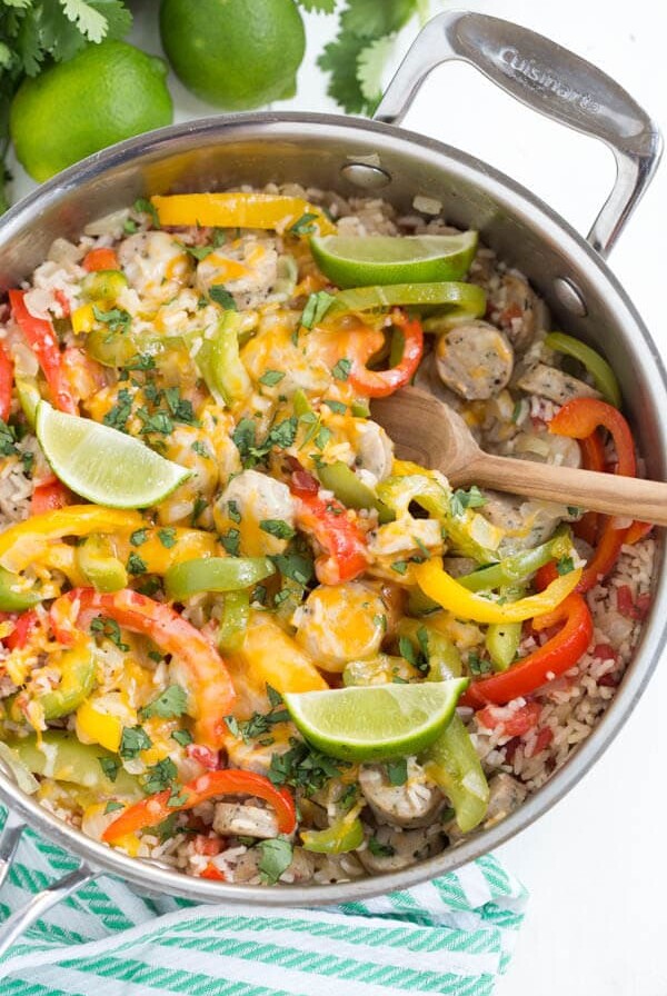 Skillet Fajita Chicken Sausage and Rice is made in one skillet and comes together in little time. Fresh bell peppers, onions, chicken sausage, fajita seasoning and rice are combined to create a meal for the entire family!