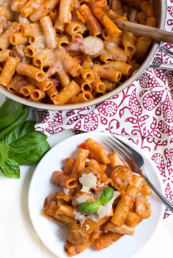 Chicken Rigatoni Pasta Skillet comes together in under 30 minutes and cooks in one pot to make clean up easy! Kids and adults will love this simple meal made with chicken sausage, rigatoni, pasta sauce, cheese and more.