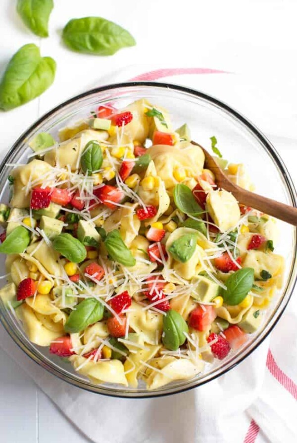 Strawberry, Corn and Avocado Tortellini Salad is a refreshing summer salad made with strawberries, corn, avocado, basil, Parmesan cheese and a simple balsamic dressing!