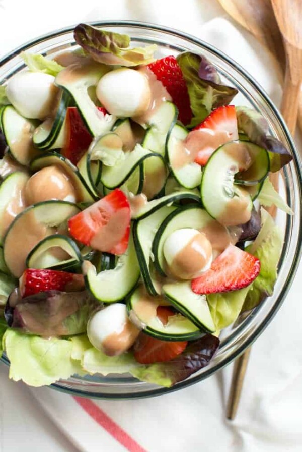 Strawberry, Cucumber and Mozzarella Salad is made with only five ingredients including a flavorful pomegranate balsamic dressing! Enjoy as a side or main dish for summer or all year long.