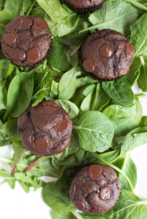 Superfood Double Chocolate Muffins are packed with leafy greens, banana, chocolate and Greek yogurt! You will never know that two heaping cups of greens are hidden in these chocolate muffins.