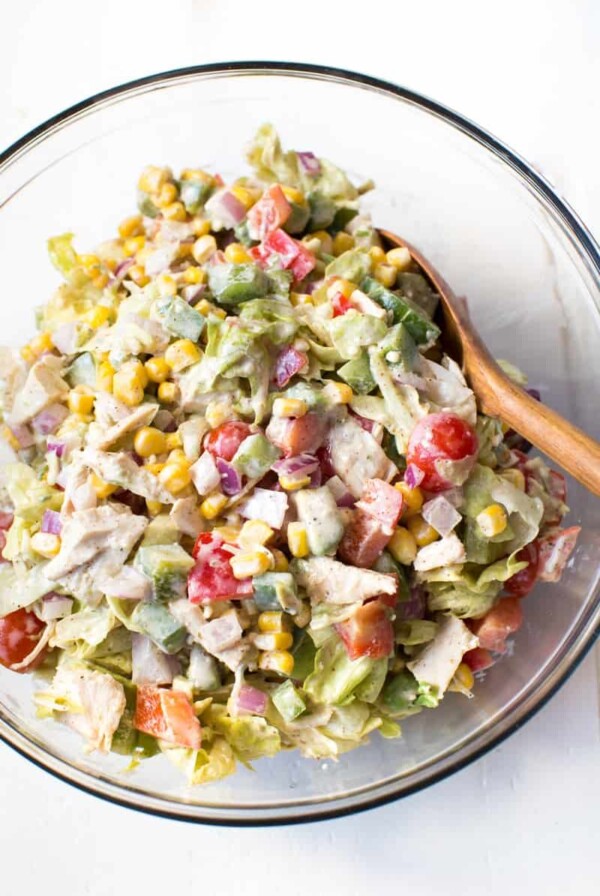 Creamy Chicken Fajita Chopped Salad comes together in less than 15 minutes! It is packed with fresh veggies, butter lettuce, creamy white cheddar dressing and fajita seasoning.