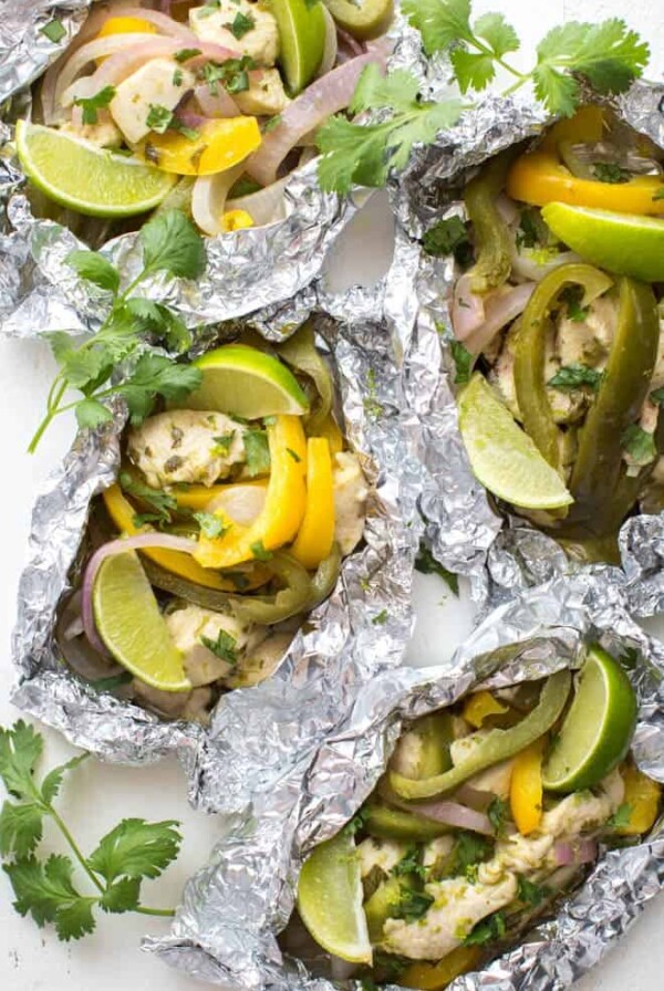 Meal Prep Cilantro Lime Chicken Fajitas in Foil are made with easy-to-find ingredients and are packed with flavor! Bake the chicken fajita filling in foil, serve with rice or tortillas and enjoy for lunch or dinner.