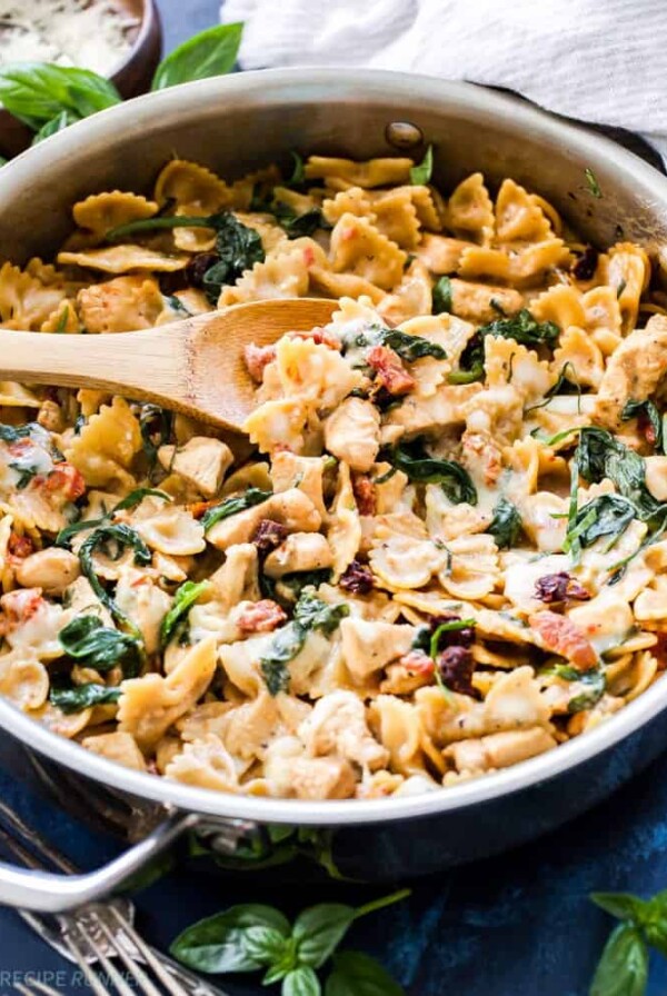 One Pot Creamy Sun Dried Tomato and Spinach Pasta with Chicken is an easy to make dinner the whole family will love! You won't believe there isn't a drop of cream in this flavorful, healthy pasta dish!