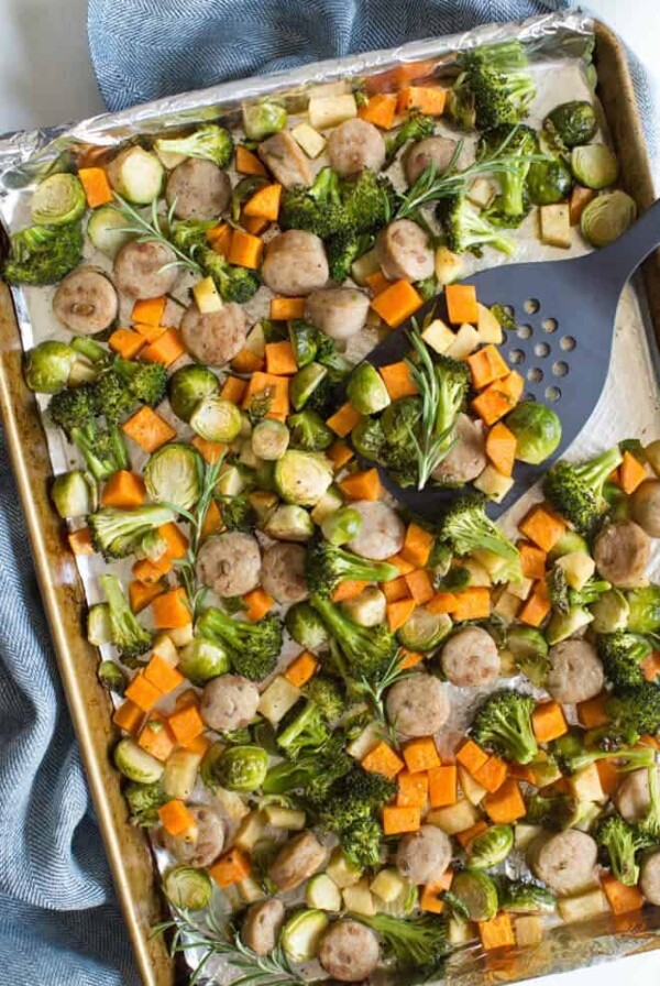 One pan chicken sausage with roasted vegetables and apples is an easy sheet pan meal that is made in less than 30 minutes! A few simple ingredients creates a flavorful fall meal.