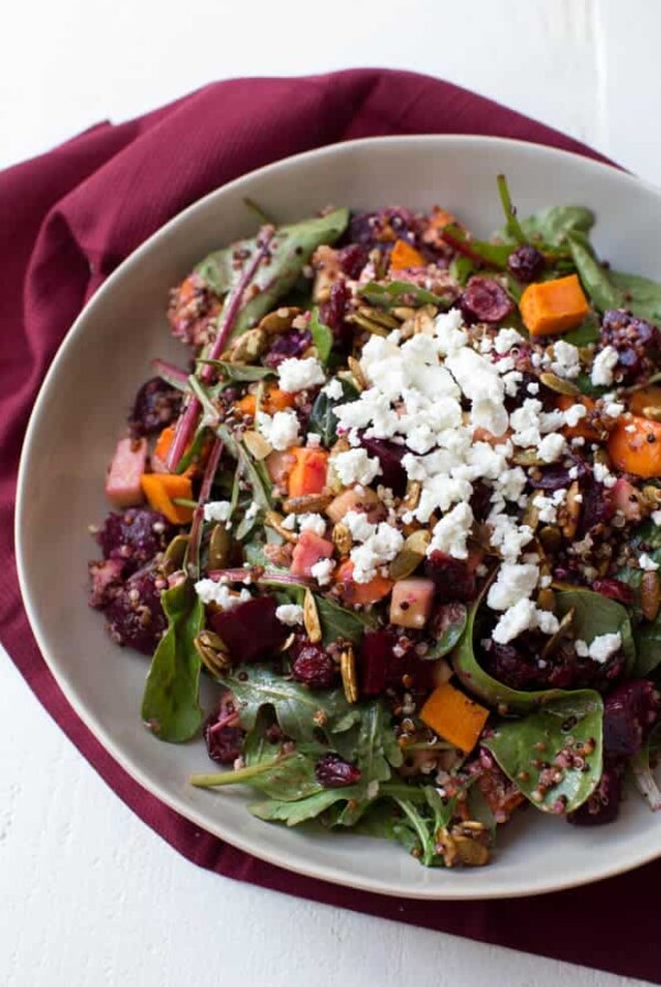 Roasted Sweet Potato, Beet, Apple and Quinoa Salad is made with fresh greens, vegetables, spiced pepitas, dried cranberries, goat cheese and a simple balsamic honey dressing!