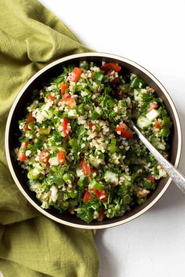 easy tabbouleh salad in a bowl with a fork in it