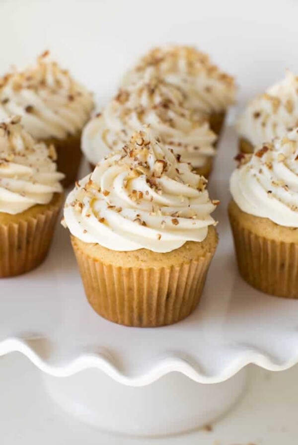 Maple Pecan Cupcakes with Maple Cream Cheese Frosting are made with a maple vanilla cupcake topped with maple cream cheese frosting and crunchy pecans! Enjoy this tasty cupcake any time of the year.