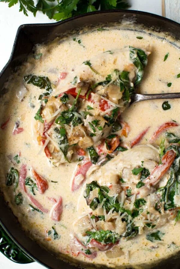 Creamy Chicken Bacon Skillet with Spinach and Roasted Red Peppers is a flavorful one pan meal that is ready in less than 30 minutes!