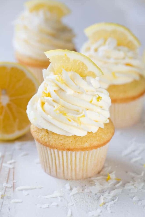 Lemon Coconut Cupcakes with Vanilla Buttercream Frosting are a delectable treat packed with the freshest lemon flavor! Bake a dozen to share with your friends and family. #meyer #lemon #cupcakes #dessert