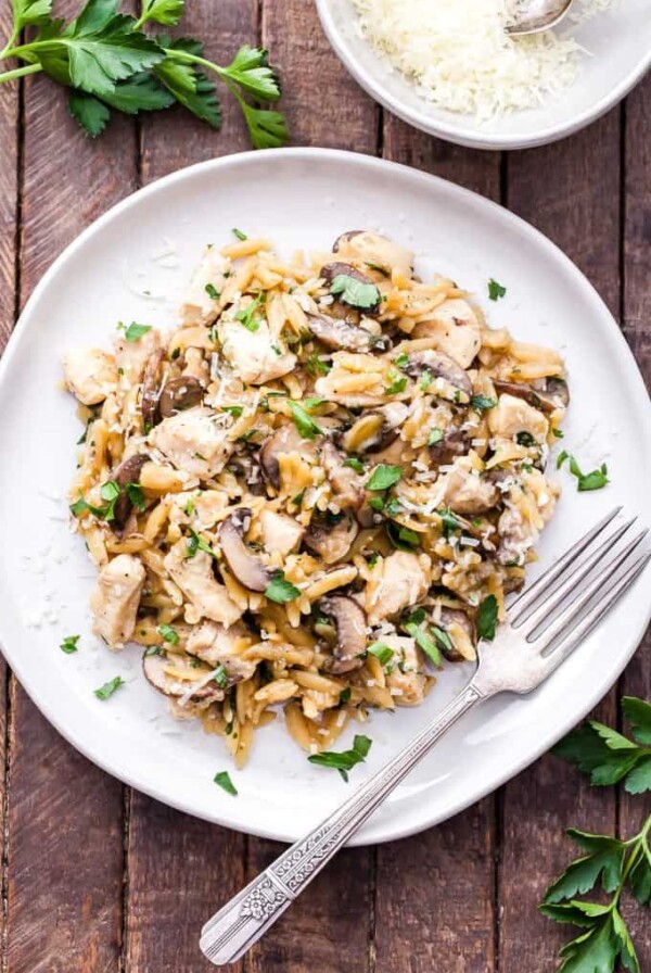 Parmesan Herb Chicken, Mushroom and Orzo Skillet is a one pan, easy to make, comfort food dinner the whole family will love! #dinner #easyrecipe #chicken #orzo