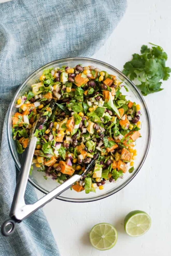 Southwest Sweet Potato Chopped Salad is made with roasted sweet potatoes, black beans, corn, red onion, avocado and chopped greens. It is served with fresh avocado cilantro dressing! #southwest #sweetpotato #chopped #salad #healthy #recipe #organicgirl #avocado #cilantro #dressing #healthyrecipe #lunch #dinner