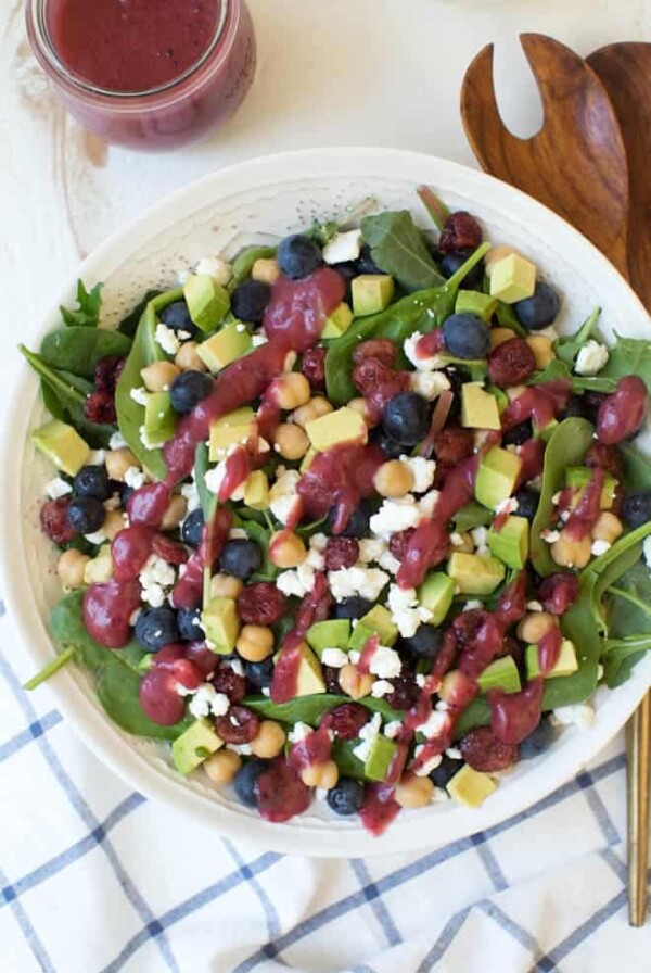 Combine the freshest flavors to create this Cranberry Blueberry and Goat Cheese Salad with Cranberry Vinaigrette Dressing. Pack in a mason jar for on-the-go or serve in a large bowl for a crowd. This antioxidant packed salad will please everyone! #salad #recipe #cranberry