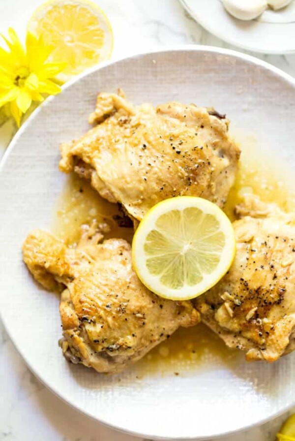 Lemon Garlic Butter Chicken Thighs are made in the Instant Pot with a few simple ingredients! The recipe is low carb and packed with flavor. #healthy #chicken #recipe #instantpot #lowcarb #dinner