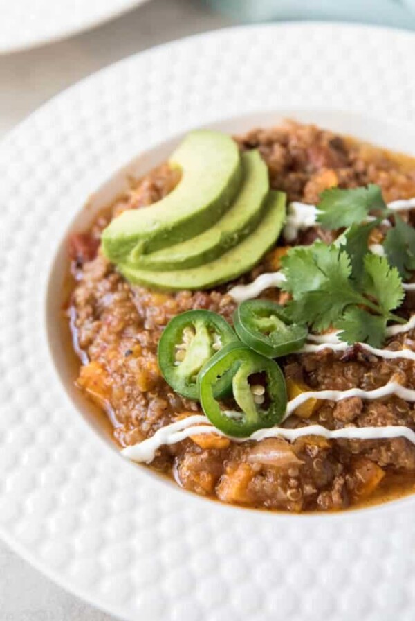 Instant Pot Turkey Chili with Sweet Potato and Quinoa is a healthier take on your favorite hearty chili! This meal is a fall favorite that the whole family will love and it cooks in the Instant Pot for an easy weeknight dinner. #turkey #chili #sweetpotato #instantpot #pressurecooker #dinner #recipe #weeknightmeal