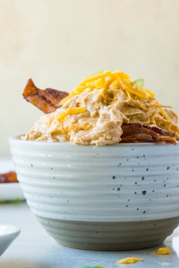 Slow Cooker Buffalo Chicken Dip is a crowd-favorite appetizer recipe that’s super easy to prepare! It’s the perfect appetizer to bring to your next party or tailgate and is made in the crock pot or slow cooker using frank's red hot sauce. #buffalo #chicken #dip #slowcooker #crockpot #recipe #holiday