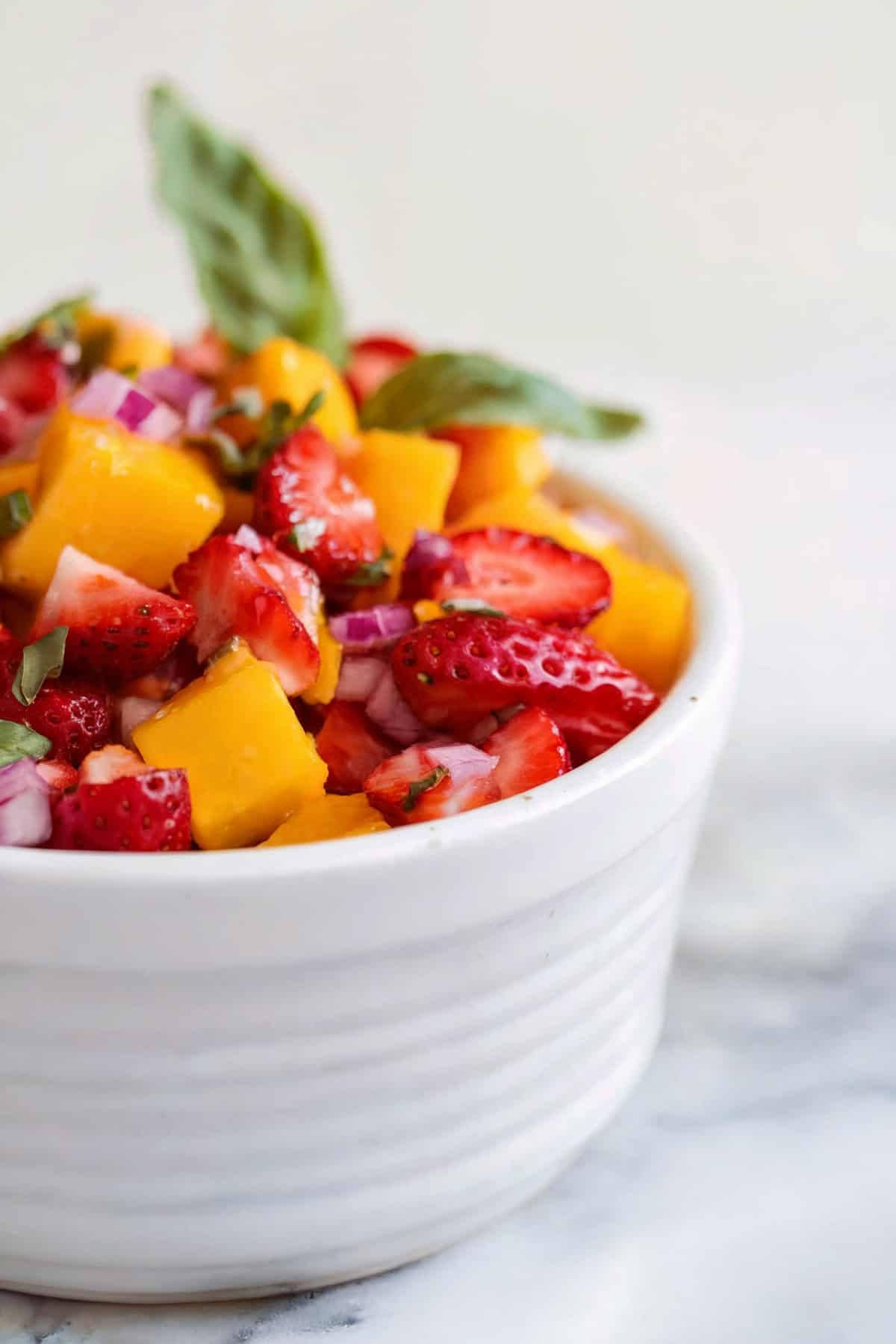 A small bowl of strawberry mango salsa