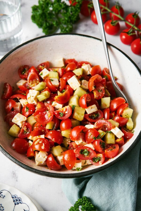 Mediterranean Cucumber and Tomato Salad with Feta in a bowl for serving.