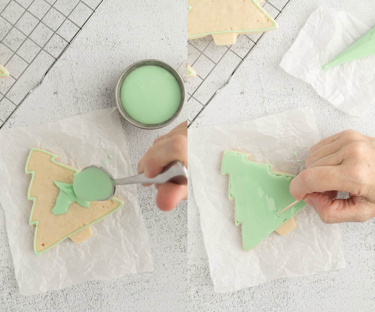 Using a spoon to flood the sugar cookies with the icing