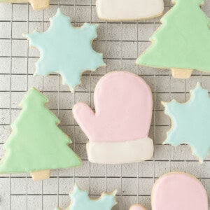 Iced Sugar Cookies on a baking rack after decorating with royal icing.