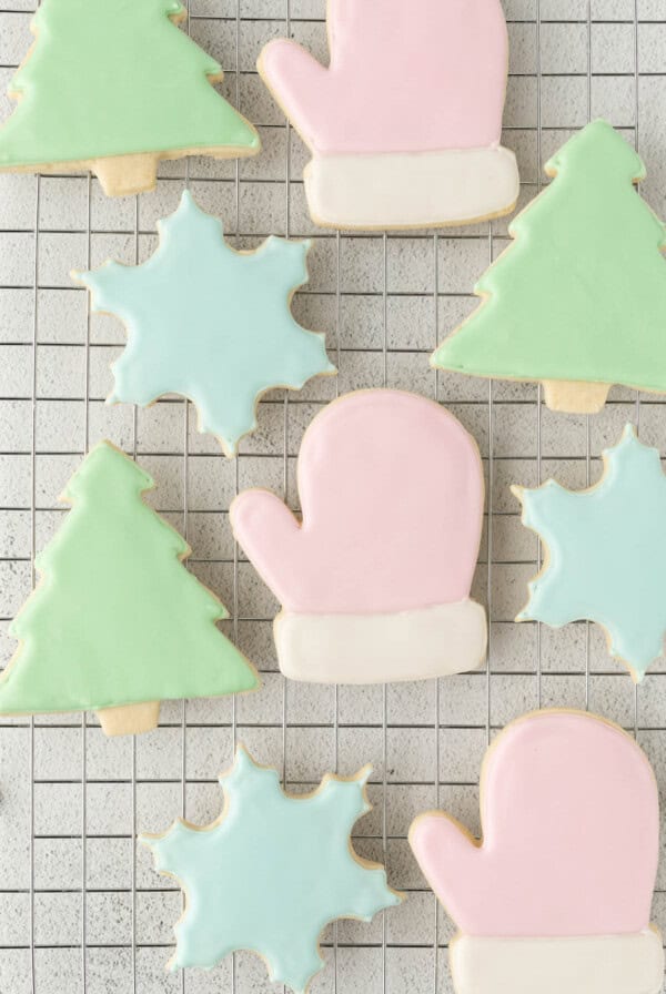 Iced Sugar Cookies on a baking rack after decorating with royal icing.