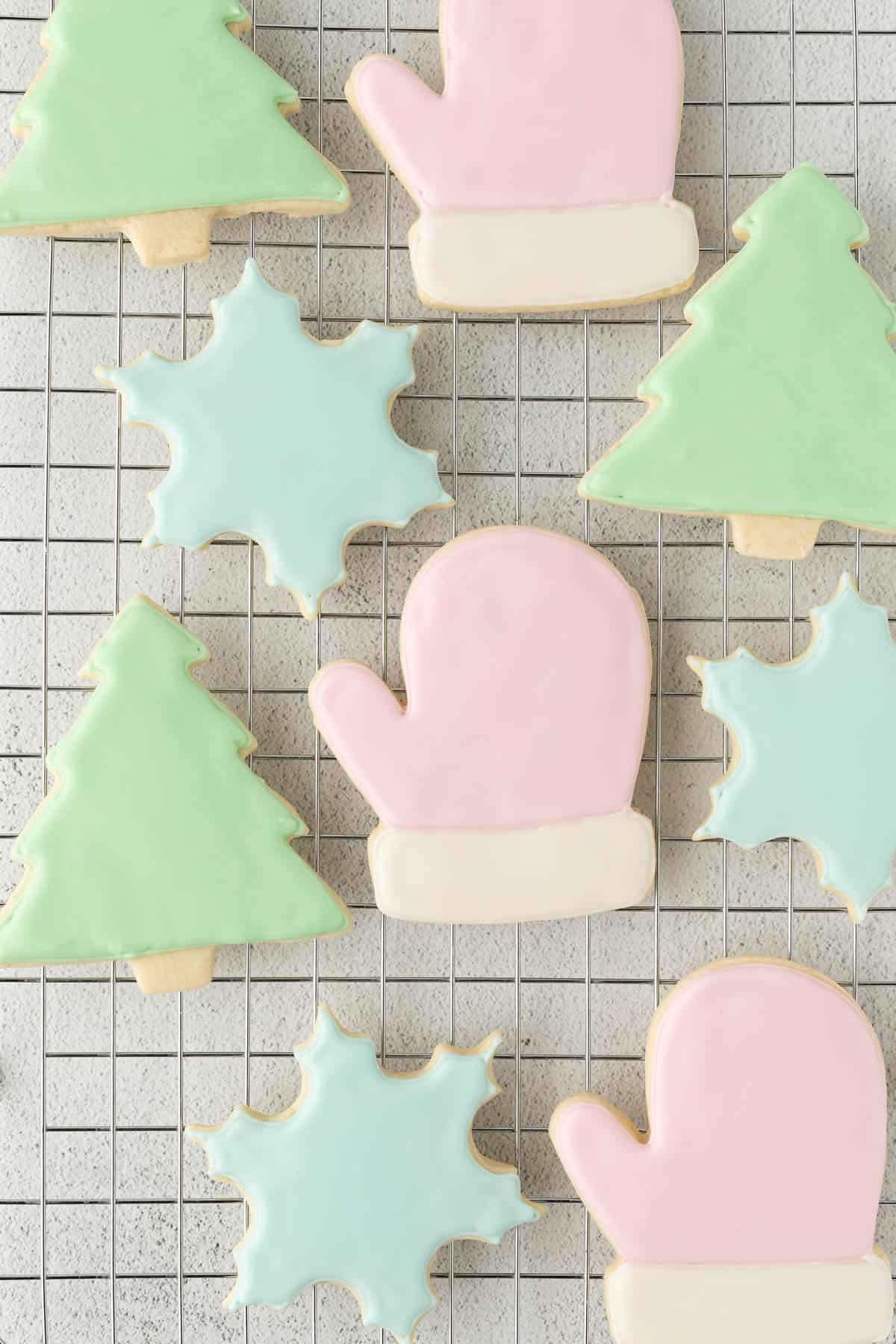 Iced Sugar Cookies on a baking rack after decorating with royal icing.