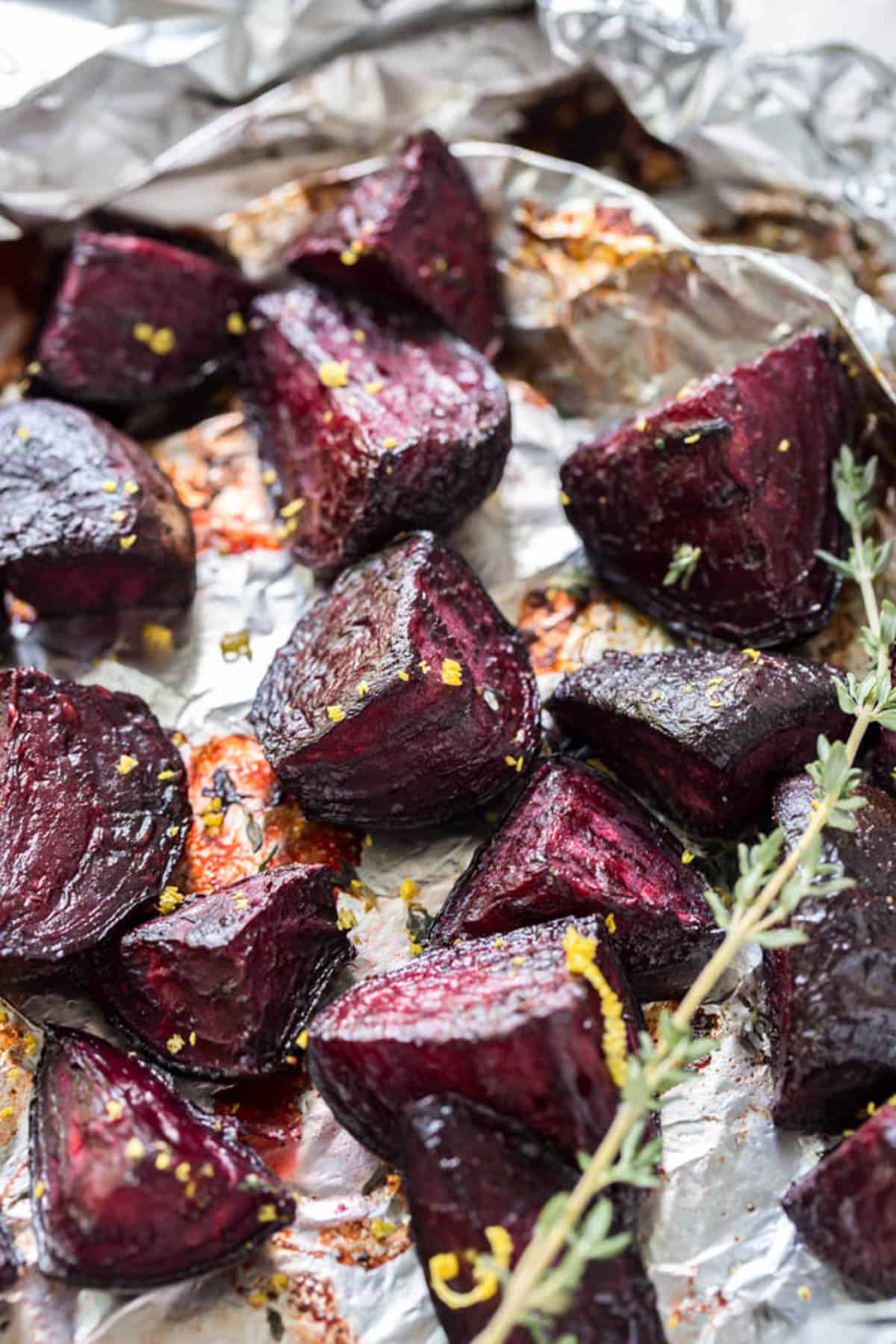 Roasted beets on a sheet pan after baking in the oven. 