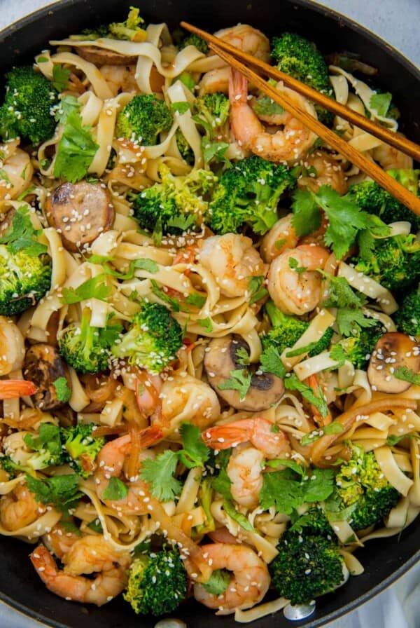 Easy Shrimp Lo Mein noodles in a skillet with the broccoli ready to serve.