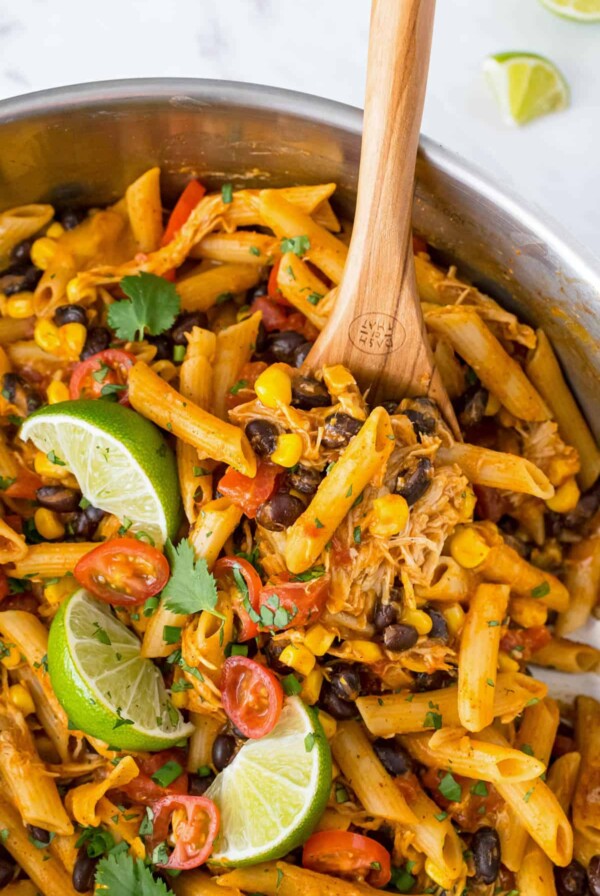 a skillet with chicken enchilada pasta