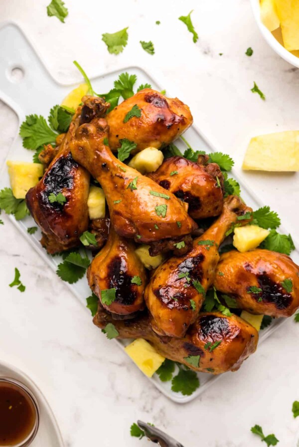 A plate of bbq chicken drumsticks