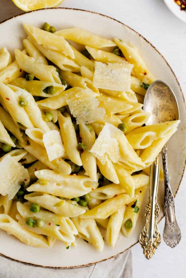 a plate of lemon pasta with peas