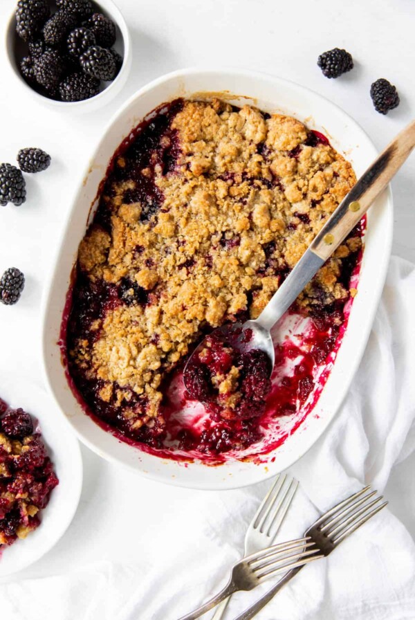 baked blackberry cobbler in white baking dish