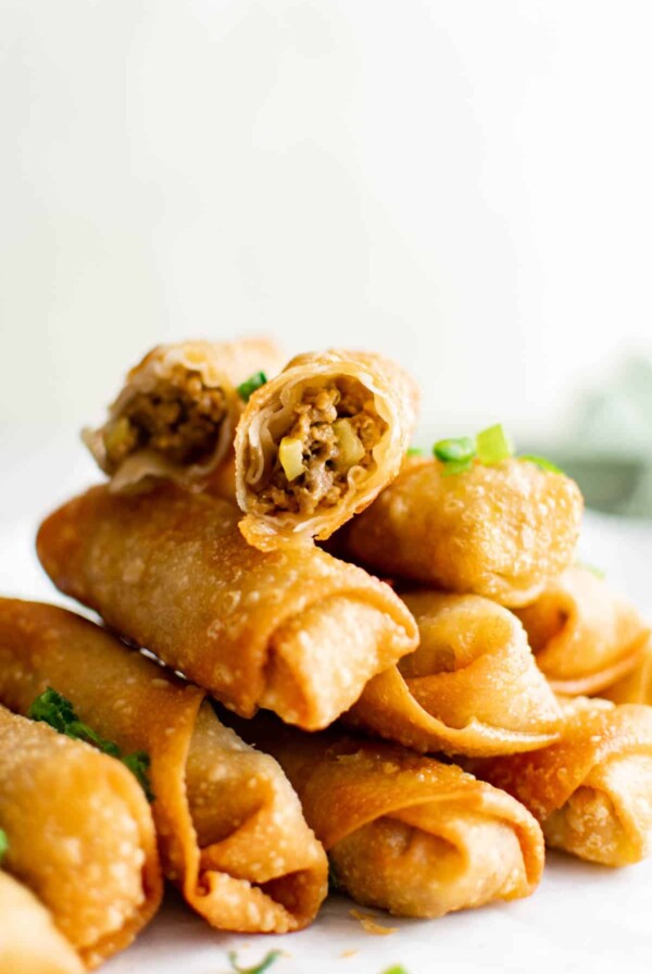 cheeseburger egg rolls stacked on top of each other