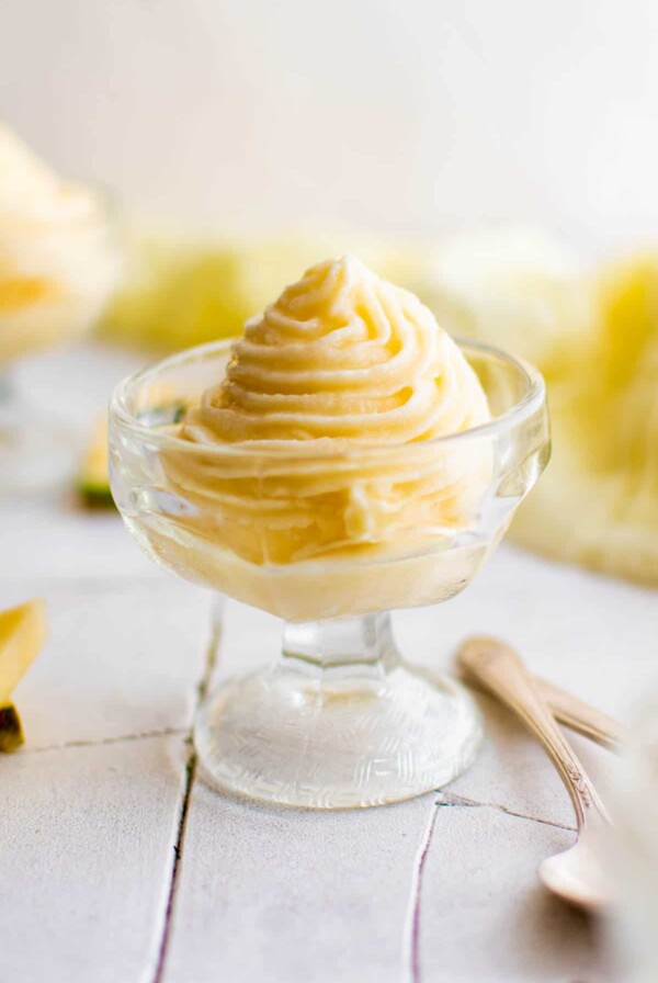 homemade pineapple dole whip in a glass on a table