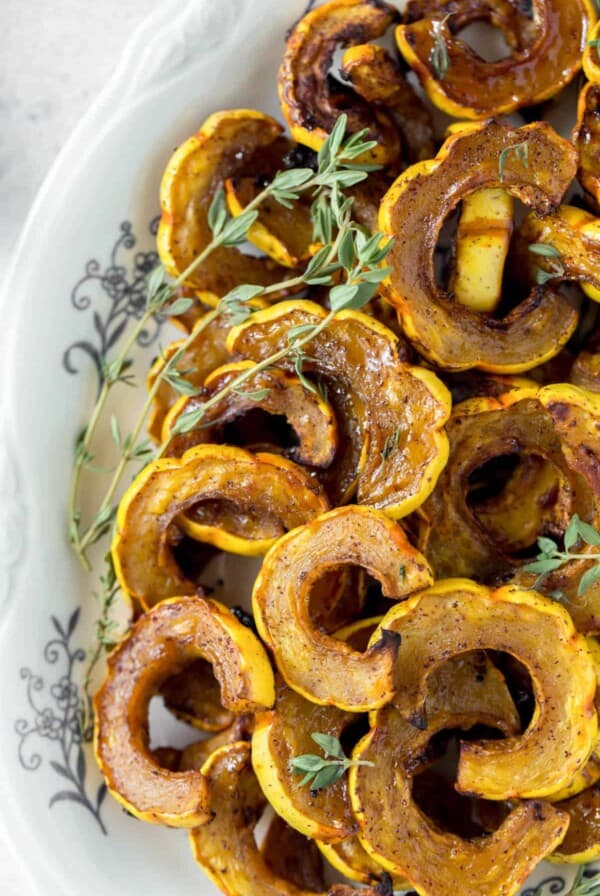 roasted delicata squash on a serving dish