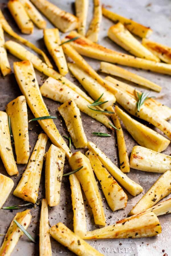 roasted parsnips on a baking sheet