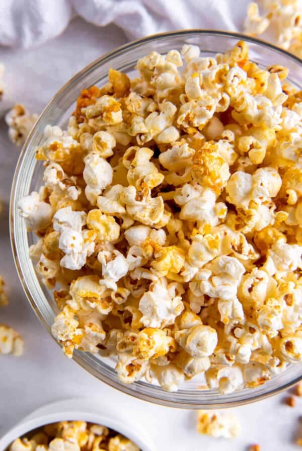 A large clear bowl filled with sweet and salty popcorn.