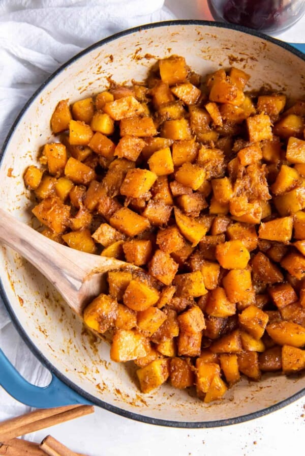 Sauteed butternut squash in a large skillet after cooking.