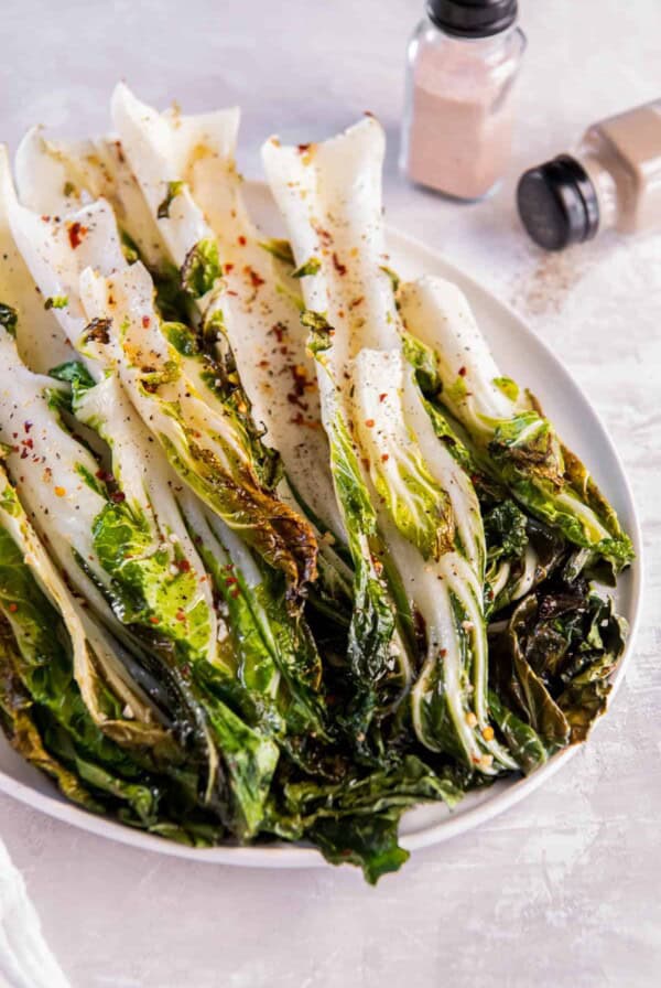 Easy roasted bok choy on a white serving plate for serving.